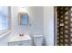 Bright bathroom with white vanity, patterned shower, and natural light at 256 Indian Trl, Marietta, GA 30068