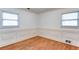Unfurnished room with hardwood floors, white walls, and classic wainscoting for trim at 256 Indian Trl, Marietta, GA 30068