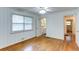 Bare bedroom features light-filled windows, hardwood floors, and white wainscoting walls at 256 Indian Trl, Marietta, GA 30068
