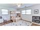 Bright bedroom featuring a wooden bunk bed, hardwood floors, and a striped area rug at 256 Indian Trl, Marietta, GA 30068