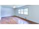 Bedroom with hardwood floors, a ceiling fan, and an abundance of natural light at 256 Indian Trl, Marietta, GA 30068