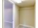 Walk-in closet with neutral walls, an overhead light, and a single hanging rod at 256 Indian Trl, Marietta, GA 30068