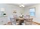 Cozy dining room featuring a round table with chairs, a patterned rug, and artwork at 256 Indian Trl, Marietta, GA 30068