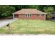A charming brick ranch home with a lush green lawn and classic curb appeal at 256 Indian Trl, Marietta, GA 30068