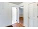 Hallway with access to bathroom and wood flooring at 256 Indian Trl, Marietta, GA 30068