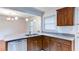 The kitchen with granite countertops, stainless steel appliances, and dark wood cabinets at 256 Indian Trl, Marietta, GA 30068