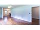 Spacious living room with hardwood floors, a ceiling fan, and ample natural light at 256 Indian Trl, Marietta, GA 30068