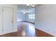 Living room with hardwood floors, a ceiling fan, and a view into other rooms at 256 Indian Trl, Marietta, GA 30068