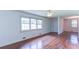 Bright living room featuring hardwood floors and large windows with natural light at 256 Indian Trl, Marietta, GA 30068