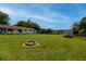 Sprawling backyard featuring a fire pit, shed, and expansive green space, ideal for outdoor entertaining and recreation at 27 Ansley Nw Way, Cartersville, GA 30121