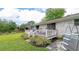 Charming backyard with a white deck, lush green grass, and mature landscaping, offering a serene outdoor retreat at 27 Ansley Nw Way, Cartersville, GA 30121