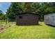 Large backyard showcases a shed, trailer, and garden area, providing ample space for storage and gardening at 27 Ansley Nw Way, Cartersville, GA 30121