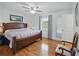 Spacious bedroom featuring hardwood floors, a large bed, and a window with outdoor views at 27 Ansley Nw Way, Cartersville, GA 30121