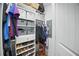 Walk-in closet with organized shelves, hanging rods, and storage baskets at 27 Ansley Nw Way, Cartersville, GA 30121