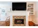 Elegant fireplace with stone surround and built-in shelving at 27 Ansley Nw Way, Cartersville, GA 30121