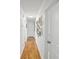 Bright hallway featuring beautiful hardwood floors and decorative picture frames at 27 Ansley Nw Way, Cartersville, GA 30121