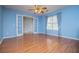 Bedroom with french doors and beautiful hardwood flooring at 6328 Wellington Ct, Douglasville, GA 30134