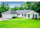 Charming one-story home with lush green lawn and well-maintained landscaping at 6328 Wellington Ct, Douglasville, GA 30134