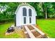 Backyard utility shed with double doors and access ramp at 6328 Wellington Ct, Douglasville, GA 30134