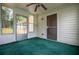 Bright sun room featuring carpet, windows and a ceiling fan at 6328 Wellington Ct, Douglasville, GA 30134