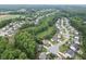 Spacious suburban area with homes nestled in a lush landscape of mature trees at 7070 Concord Mountain Trl, Cumming, GA 30028