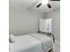Cozy bedroom featuring neutral walls, ceiling fan, and view to hall through an open door at 7070 Concord Mountain Trl, Cumming, GA 30028