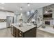 Kitchen with a view of the living room, island with granite countertops, and stainless-steel appliances at 7070 Concord Mountain Trl, Cumming, GA 30028