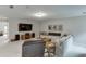 Cozy living room with plush seating, a large TV, and natural light at 7070 Concord Mountain Trl, Cumming, GA 30028
