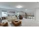 Bright living room with lots of space, large windows, and comfortable furnishings at 7070 Concord Mountain Trl, Cumming, GA 30028