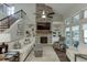 Bright living room features a brick fireplace, built-in shelving, and large windows with natural light at 7070 Concord Mountain Trl, Cumming, GA 30028