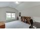 Bright, spacious home office with a large window for natural light and built-in bookcases at 7070 Concord Mountain Trl, Cumming, GA 30028