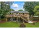 Large, well-maintained backyard with a deck and patio, ideal for entertaining and relaxation at 735 Waterbrook Ter, Roswell, GA 30076