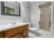 Bathroom featuring wooden vanity with sink and shower with glass doors at 735 Waterbrook Ter, Roswell, GA 30076