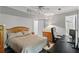 Bedroom with a desk, drawers, and neutral bedding in a well-lit space at 735 Waterbrook Ter, Roswell, GA 30076