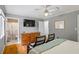 Comfortable bedroom with hardwood floors, contemporary furniture, and a connected bathroom at 735 Waterbrook Ter, Roswell, GA 30076
