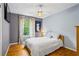 Serene bedroom featuring hardwood floors, natural light, and calming decor at 735 Waterbrook Ter, Roswell, GA 30076