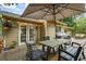 Cozy deck with outdoor lighting, a table, chairs, and a grill, great for gatherings and enjoying the view at 735 Waterbrook Ter, Roswell, GA 30076
