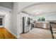 Bright kitchen with stainless steel appliances, granite countertops, and white cabinetry at 735 Waterbrook Ter, Roswell, GA 30076