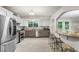 Spacious kitchen featuring stainless steel appliances, granite countertops, and bar seating at 735 Waterbrook Ter, Roswell, GA 30076