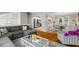 Open concept living room featuring hardwood floors, grey decor and a modern design aesthetic at 735 Waterbrook Ter, Roswell, GA 30076