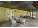 Covered patio with a table and chairs, perfect for outdoor dining and entertaining guests at 735 Waterbrook Ter, Roswell, GA 30076