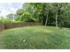 Fenced backyard with lush green grass, offering privacy and space for outdoor enjoyment at 2510 Brentwood Ct, Decatur, GA 30032