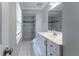 Bathroom featuring a vanity with drawers, a toilet, tile floors, and a tiled shower stall at 2510 Brentwood Ct, Decatur, GA 30032