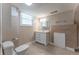 Cozy bathroom with tiled floor features a single sink vanity and bright mirror at 2510 Brentwood Ct, Decatur, GA 30032