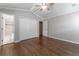 Bedroom featuring hardwood floors, a ceiling fan, walk-in closet, and an ensuite bathroom at 2510 Brentwood Ct, Decatur, GA 30032