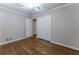 Bedroom featuring hardwood floors, a ceiling fan, and a double closet at 2510 Brentwood Ct, Decatur, GA 30032