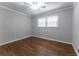 Bedroom with hardwood floors, a ceiling fan, and two windows at 2510 Brentwood Ct, Decatur, GA 30032