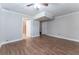 Open living room offers wood floors, neutral paint, and bright ceiling fan at 2510 Brentwood Ct, Decatur, GA 30032