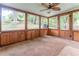 This screened in porch has a ceiling fan and access to the backyard at 2510 Brentwood Ct, Decatur, GA 30032