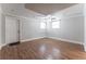 Room featuring wood-look flooring, a ceiling fan, and a door to the exterior at 2510 Brentwood Ct, Decatur, GA 30032